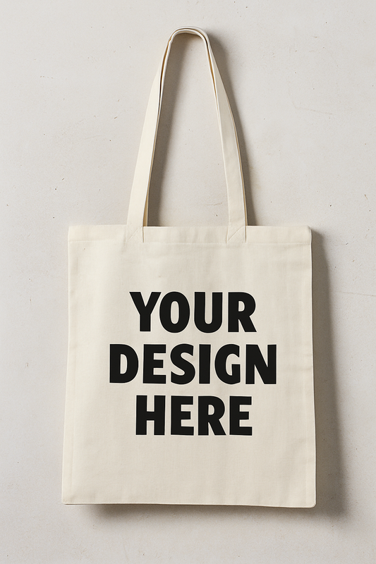 Custom beige tote bag with “Your Design Here” printed in black bold text.