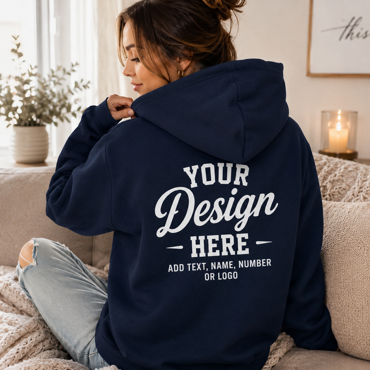 Woman wearing personalized navy hoodie in cozy lifestyle setting